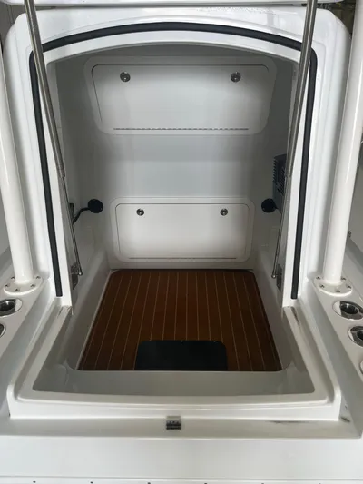  Yacht Photos Pics 2022 Yellowfin 34 boat cabin interior with wood flooring and storage compartments.