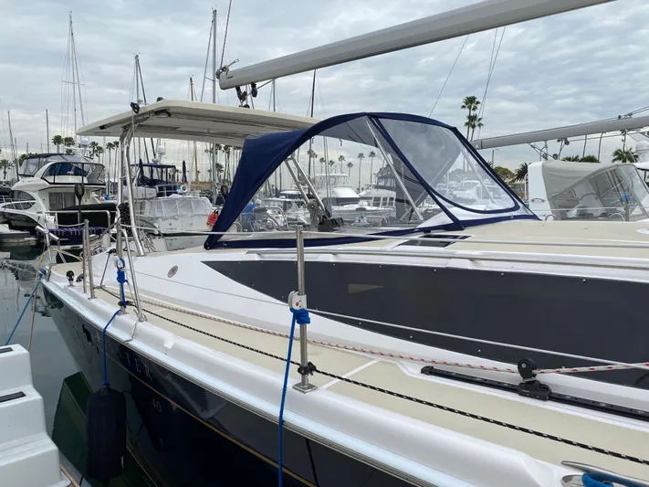 Nymph Yacht Photos Pics 2014 Marlow Hunter 40 sailboat docked in marina, featuring sleek design and blue canopy.