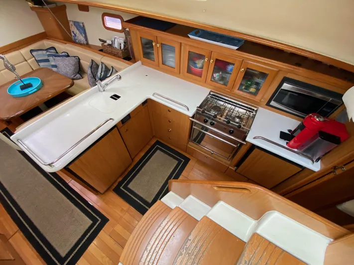 Nymph Yacht Photos Pics Interior of 2014 Marlow Hunter 40 yacht with modern kitchen and dining area.