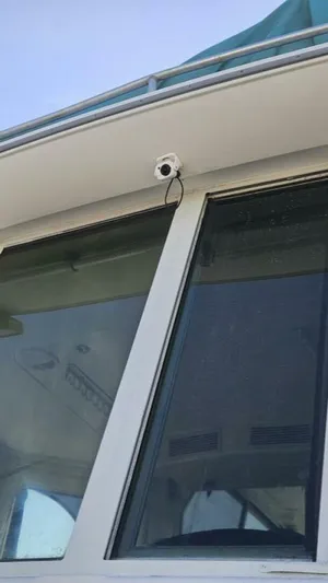 Elusive Yacht Photos Pics 1997 Carver 500 Cockpit Motor Yacht with security camera installed on the exterior.