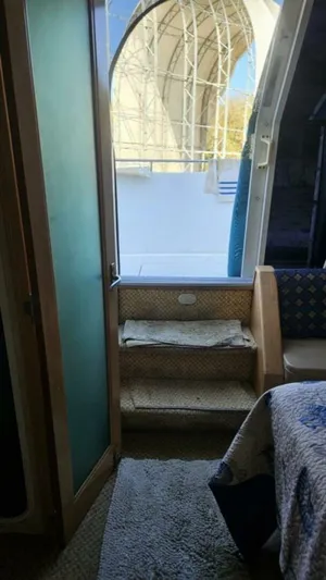 Elusive Yacht Photos Pics Interior view of 1997 Carver 500 Cockpit Motor Yacht with steps leading outside.