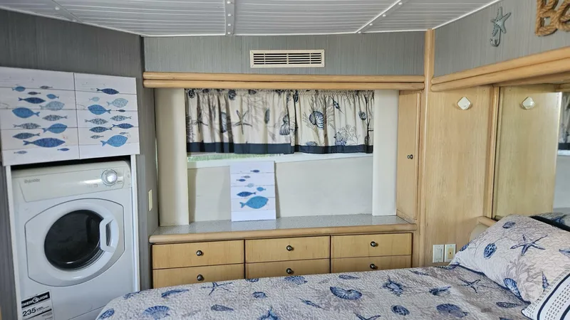 Elusive Yacht Photos Pics 1997 Carver 500 Cockpit Motor Yacht interior with nautical-themed decor and built-in washer.