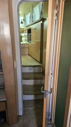 Elusive Yacht Photos Pics Interior view of 1997 Carver 500 Cockpit Motor Yacht, showing stairs and cabin area.