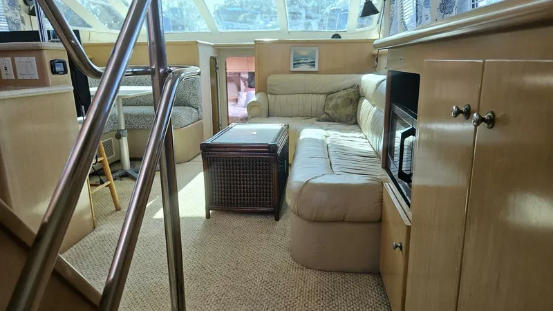 Elusive Yacht Photos Pics Interior of 1997 Carver 500 Cockpit Motor Yacht with cozy seating and natural light.
