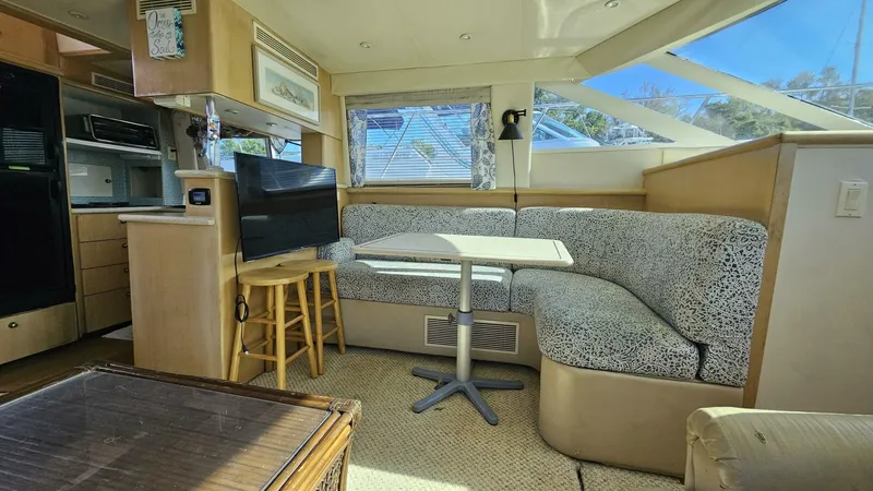 Elusive Yacht Photos Pics Interior of 1997 Carver 500 Cockpit Motor Yacht with cozy seating and modern amenities.