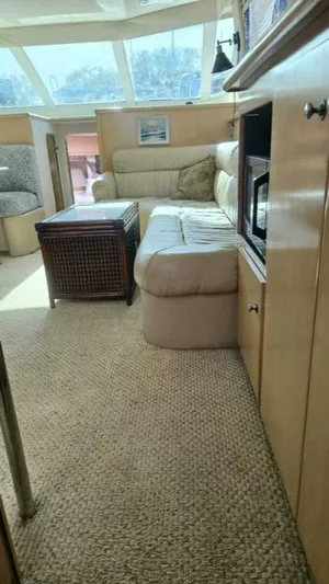 Elusive Yacht Photos Pics Interior of 1997 Carver 500 Cockpit Motor Yacht with beige seating and carpet.