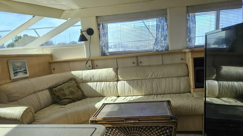 Elusive Yacht Photos Pics Luxurious interior of 1997 Carver 500 Cockpit Motor Yacht with plush seating and elegant decor.