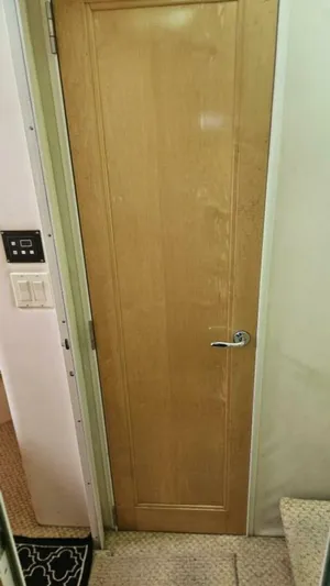 Elusive Yacht Photos Pics Wooden door inside 1997 Carver 500 Cockpit Motor Yacht, featuring a sleek handle.