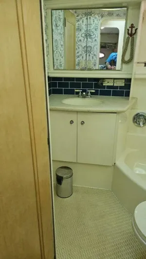 Elusive Yacht Photos Pics Bathroom interior of 1997 Carver 500 Cockpit Motor Yacht with mirror and sink.