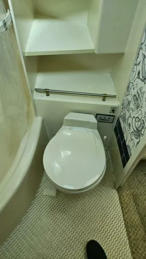 Elusive Yacht Photos Pics 1997 Carver 500 Cockpit Motor Yacht bathroom with toilet and shower area.