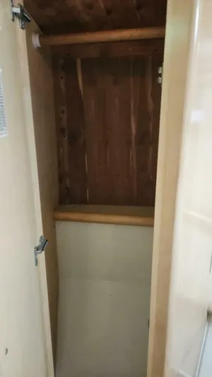 Elusive Yacht Photos Pics Empty wooden closet inside 1997 Carver 500 Cockpit Motor Yacht.