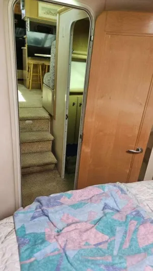 Elusive Yacht Photos Pics Interior view of 1997 Carver 500 Cockpit Motor Yacht, showing stairs and cozy cabin area.