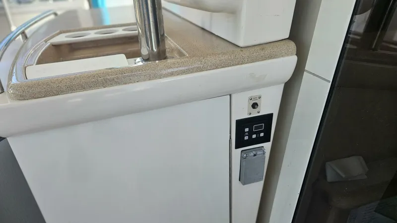 Elusive Yacht Photos Pics Control panel on 1997 Carver 500 Cockpit Motor Yacht, featuring switches and outlets.