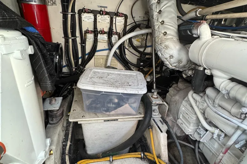 Dark And Stormy Yacht Photos Pics Engine room of a 2000 Tiara Yachts 3500 Express, featuring mechanical components and wiring.