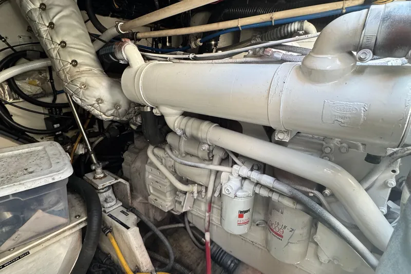 Dark And Stormy Yacht Photos Pics Engine room of a 2000 Tiara Yachts 3500 Express, showcasing detailed mechanical components.