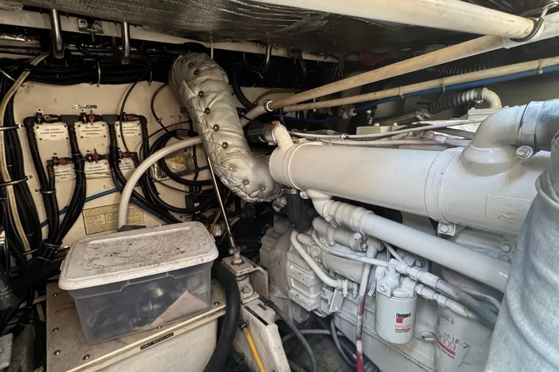 Dark And Stormy Yacht Photos Pics Engine room of a 2000 Tiara Yachts 3500 Express, showcasing mechanical components and wiring.