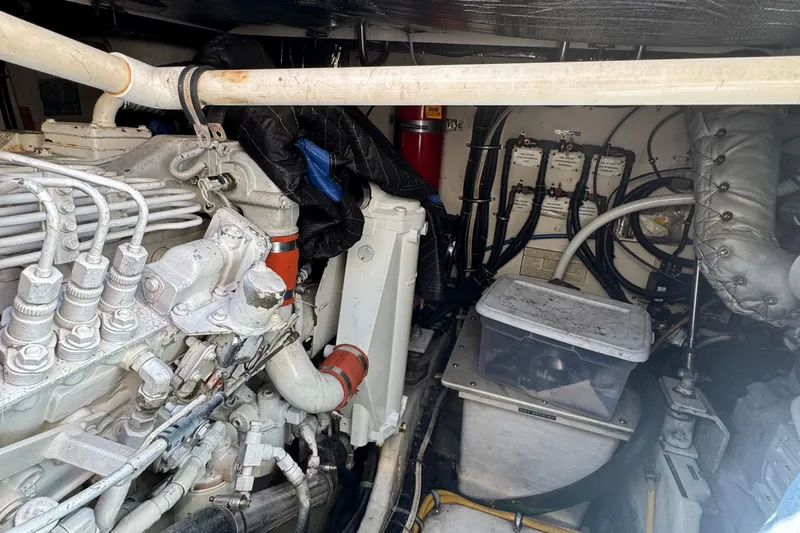 Dark And Stormy Yacht Photos Pics Engine room of a 2000 Tiara Yachts 3500 Express, showcasing mechanical components and wiring.