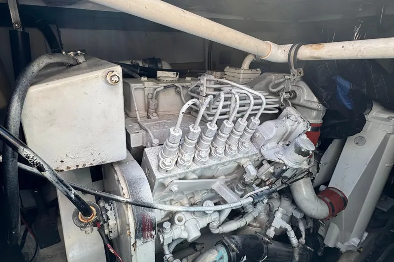 Dark And Stormy Yacht Photos Pics Engine compartment of a 2000 Tiara Yachts 3500 Express, showcasing mechanical components.