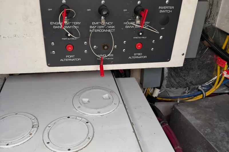 Dark And Stormy Yacht Photos Pics Control panel of a 2000 Tiara Yachts 3500 Express, featuring battery switches and alternator controls.