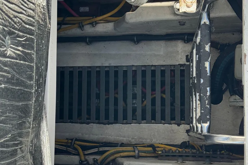 Dark And Stormy Yacht Photos Pics Engine compartment of a 2000 Tiara Yachts 3500 Express with visible wiring and components.