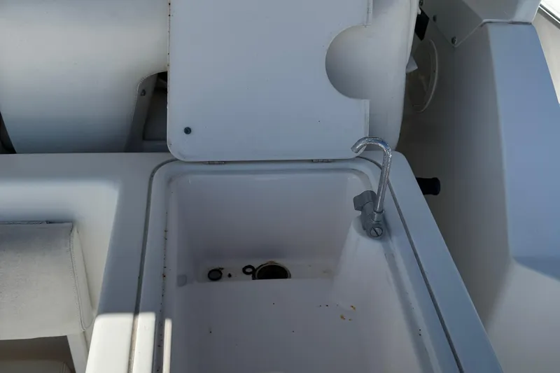 Dark And Stormy Yacht Photos Pics Tiara Yachts 3500 Express 2000 model sink area with faucet and storage compartment.