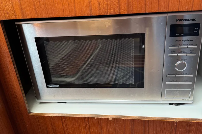 Dark And Stormy Yacht Photos Pics Panasonic microwave in 2000 Tiara Yachts 3500 Express, wood paneling background.
