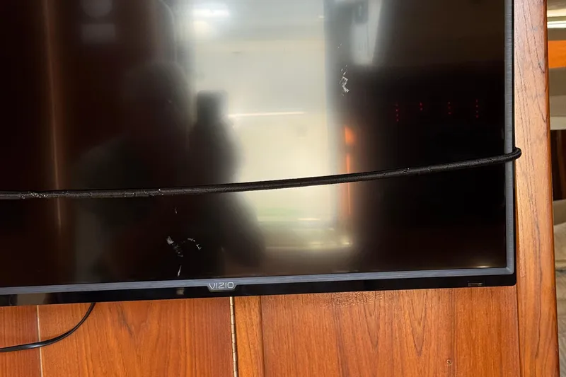 Dark And Stormy Yacht Photos Pics Vizio TV mounted on wooden panel inside 2000 Tiara Yachts 3500 Express.