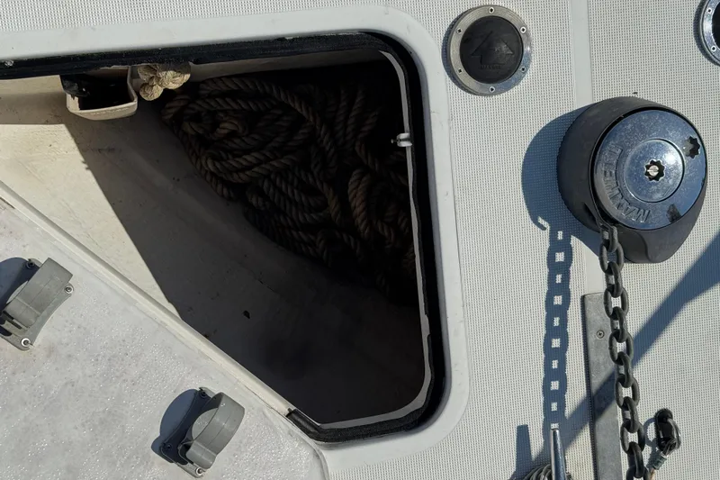 Dark And Stormy Yacht Photos Pics Anchor locker and windlass on 2000 Tiara Yachts 3500 Express boat deck.