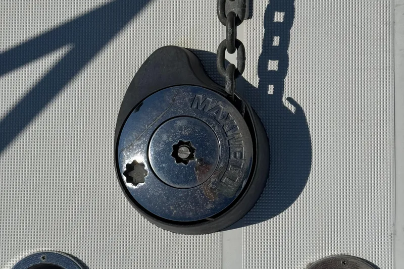 Dark And Stormy Yacht Photos Pics Anchor windlass on 2000 Tiara Yachts 3500 Express, featuring Maxwell branding.