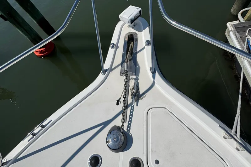 Dark And Stormy Yacht Photos Pics Bow of 2000 Tiara Yachts 3500 Express with anchor and chain visible.