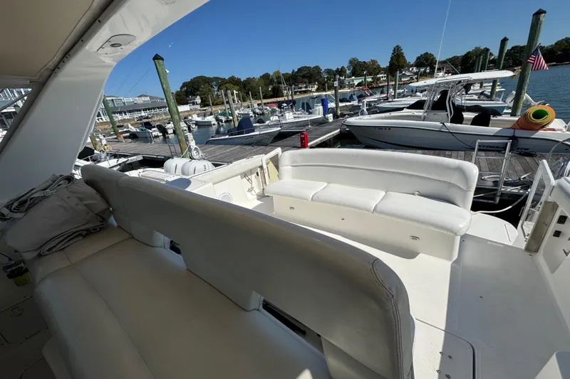 Dark And Stormy Yacht Photos Pics 2000 Tiara Yachts 3500 Express at marina, featuring spacious seating and docked boats.