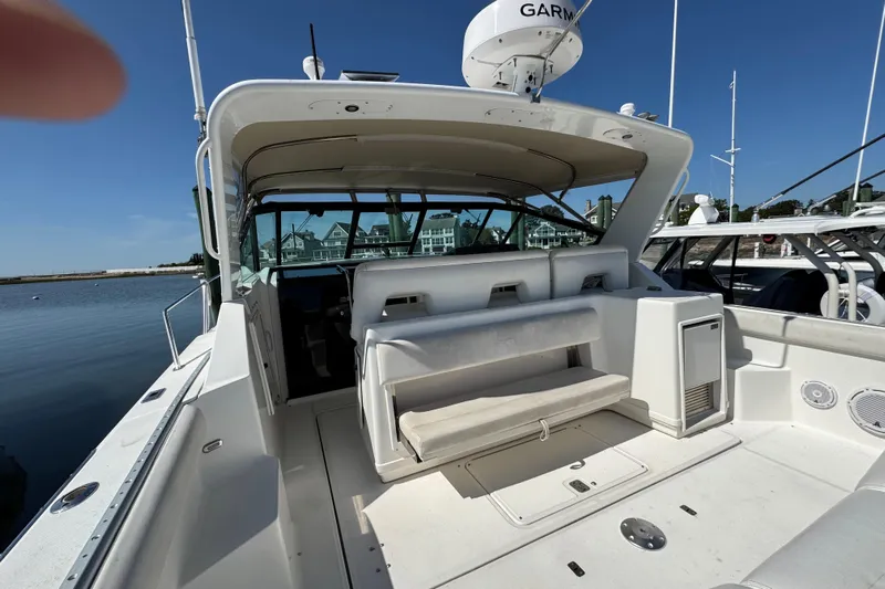 Dark And Stormy Yacht Photos Pics 2000 Tiara Yachts 3500 Express boat interior with seating and navigation equipment.