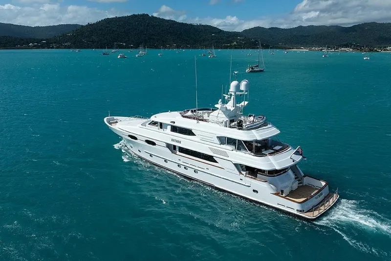 Batavia Yacht Photos Pics Luxurious 2003 Richmond Yachts 135 Motor Yacht cruising in turquoise waters.