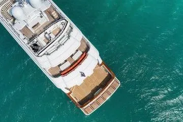 Batavia Yacht Photos Pics Aerial view of 2003 Richmond Yachts 135 Motor Yacht on turquoise water.