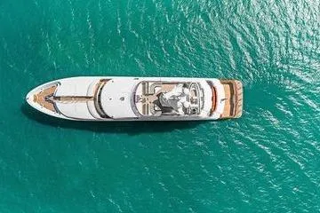 Batavia Yacht Photos Pics Aerial view of 2003 Richmond Yachts 135 Motor Yacht on turquoise water.