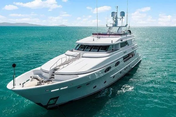 Batavia Yacht Photos Pics Luxurious 2003 Richmond Yachts 135 Motor Yacht cruising on turquoise waters.