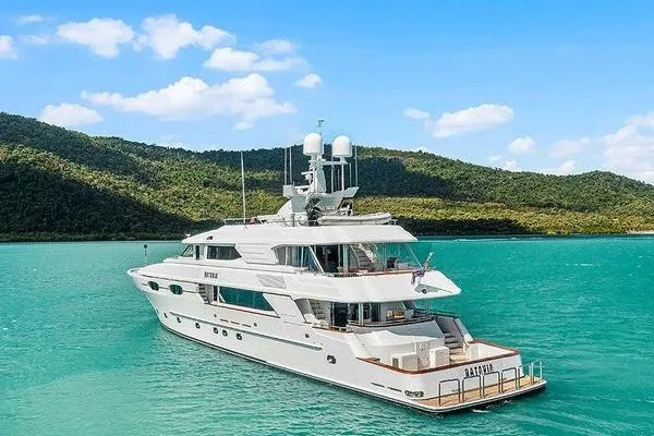 Batavia Yacht Photos Pics Luxury Richmond Yachts 135 Motor Yacht, 2003, cruising in turquoise waters with scenic mountain backdrop.