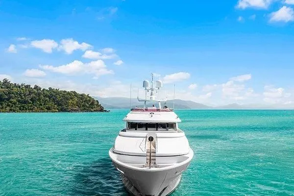 Batavia Yacht Photos Pics Luxurious 2003 Richmond Yachts 135 Motor Yacht on turquoise waters under clear blue sky.
