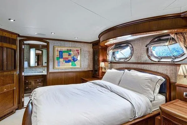 Batavia Yacht Photos Pics Luxurious bedroom interior of 2003 Richmond Yachts 135 Motor Yacht with elegant wood finishes.