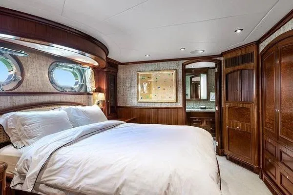 Batavia Yacht Photos Pics Luxurious bedroom interior of 2003 Richmond Yachts 135 Motor Yacht with elegant wood finishes.