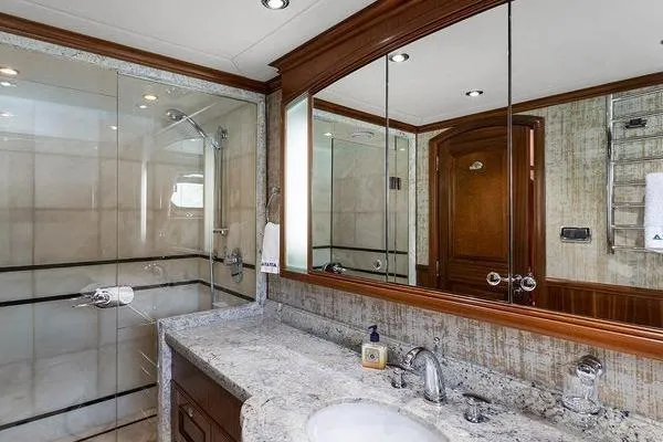 Batavia Yacht Photos Pics Luxurious bathroom in 2003 Richmond Yachts 135 Motor Yacht with marble countertop and glass shower.