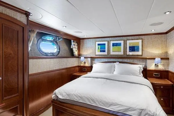 Batavia Yacht Photos Pics Luxurious bedroom interior of 2003 Richmond Yachts 135 Motor Yacht with elegant wood finishes.