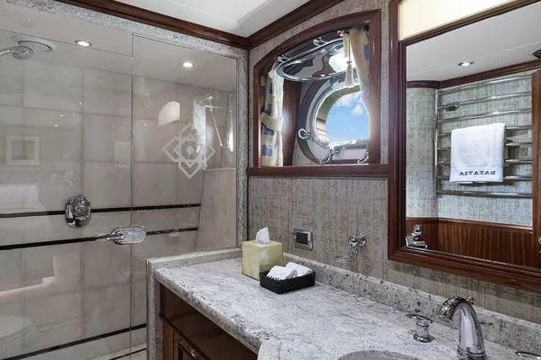 Batavia Yacht Photos Pics Luxurious bathroom on 2003 Richmond Yachts 135 Motor Yacht with elegant fixtures and porthole window.