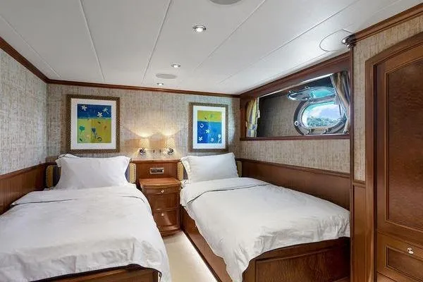 Batavia Yacht Photos Pics Luxurious twin bedroom on 2003 Richmond Yachts 135 Motor Yacht, featuring elegant wood finishes.