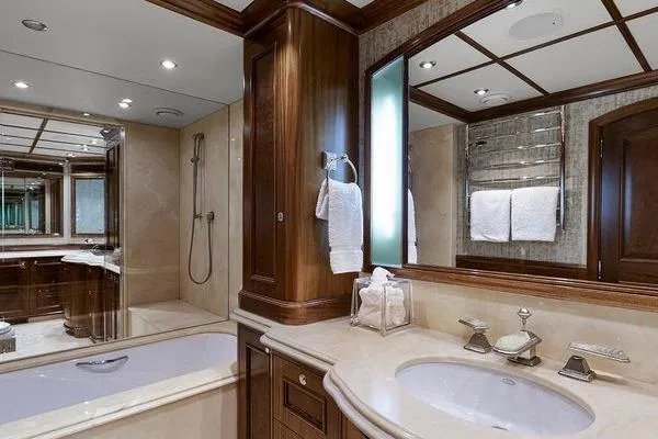 Batavia Yacht Photos Pics Luxurious bathroom in 2003 Richmond Yachts 135 Motor Yacht, featuring elegant wood and marble finishes.