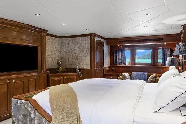 Batavia Yacht Photos Pics Luxurious bedroom interior of 2003 Richmond Yachts 135 Motor Yacht with elegant wood paneling.