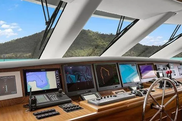 Batavia Yacht Photos Pics Richmond Yachts 135 Motor Yacht 2003 cockpit with navigation screens and steering wheel.