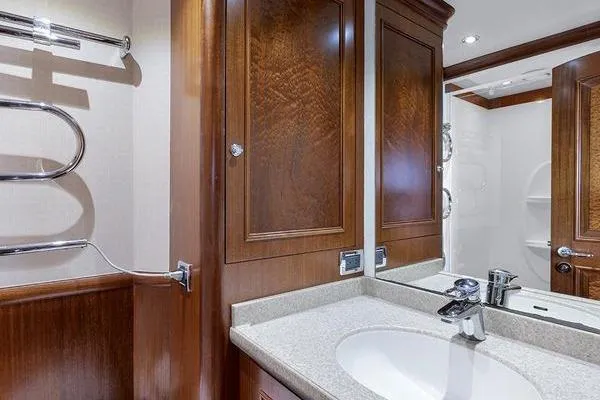 Batavia Yacht Photos Pics Luxurious bathroom interior on 2003 Richmond Yachts 135 Motor Yacht, featuring elegant wood cabinetry.