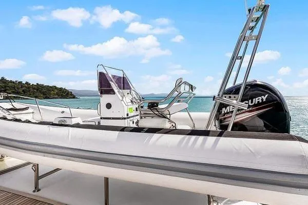 Batavia Yacht Photos Pics Richmond Yachts 135 Motor Yacht, 2003 model, featuring a Mercury outboard motor, ocean backdrop.