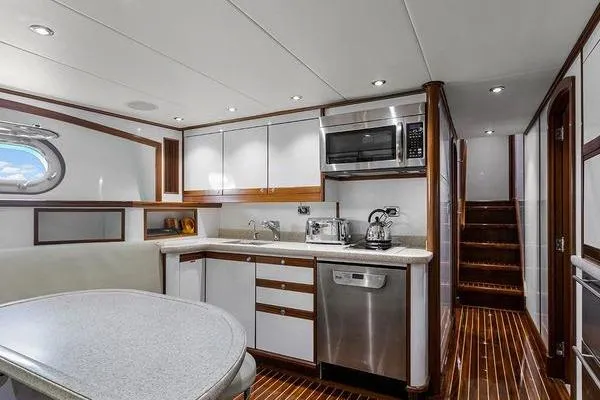 Batavia Yacht Photos Pics Luxurious kitchen interior of 2003 Richmond Yachts 135 Motor Yacht with modern appliances.